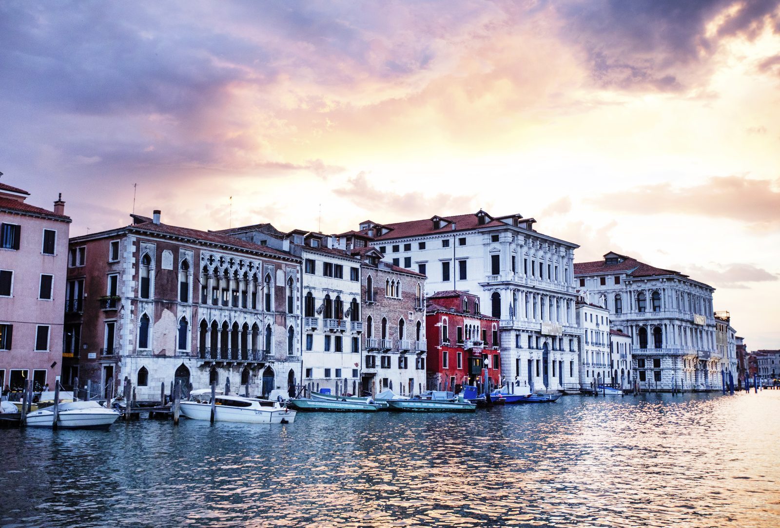 The Grand Canal at sundown, with palazzi catching the last light and reflecting in still water